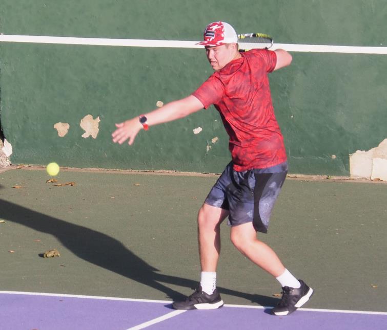 Nathan plays a top-spin forehand